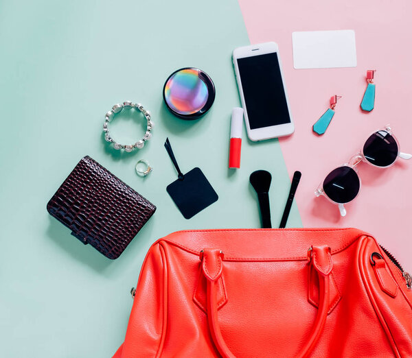Flat lay of pink cute woman bag 