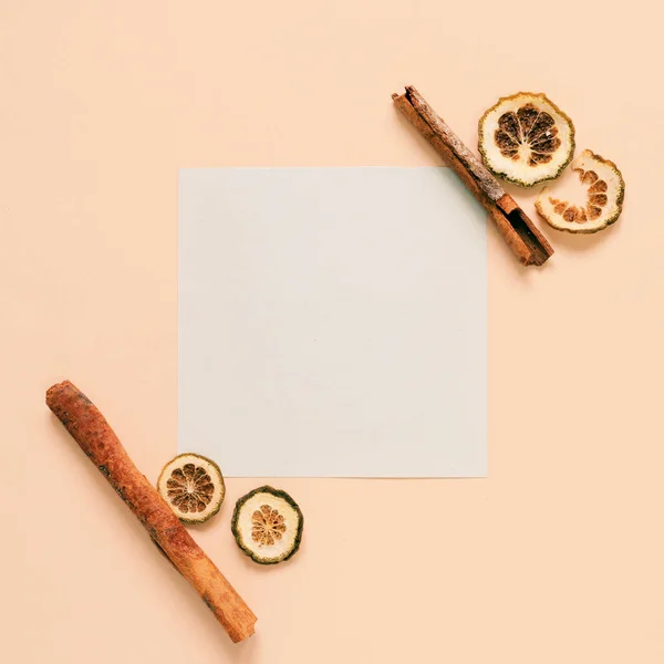 Blank paper with cinnamon sticks — Stock Photo, Image