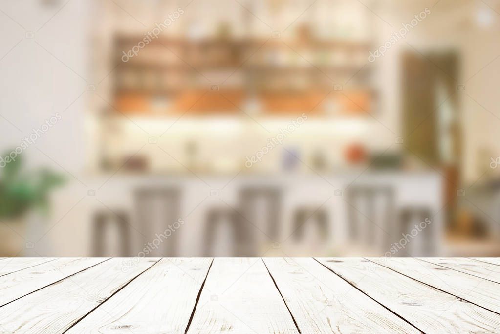 Empty wood table top on blur abstract of cafe or bar background, for montage product display