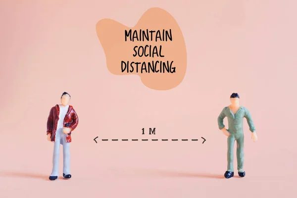 Social distance concept, miniature cartoon people standing keep distance in public at least 1 meter to protect from Covid-19 and Coronavirus, prevention the outbreak spreading