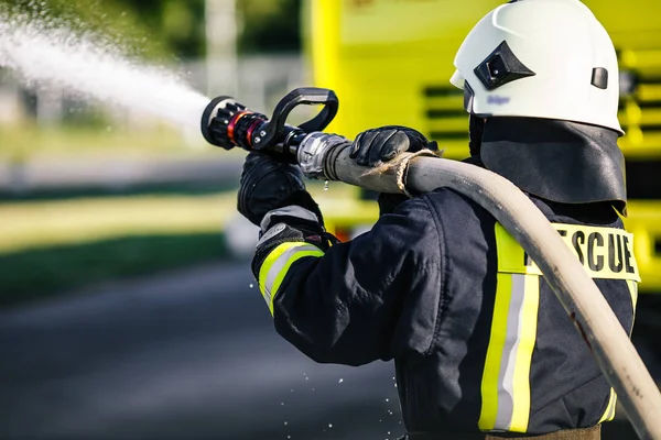 Fireman drills, water spill combustion zone — Stock Photo, Image