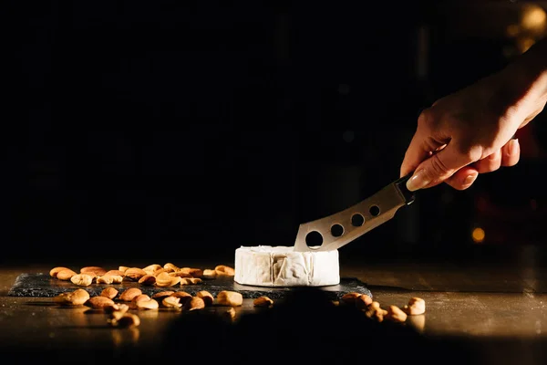 Cheese with nuts on table — Stock Photo, Image