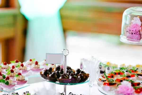 Sweets on holiday party table — Stock Photo, Image