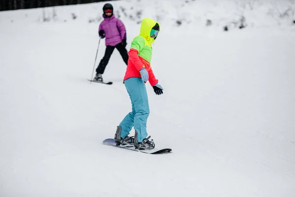 Young girls in winter mountain — Stock Photo, Image