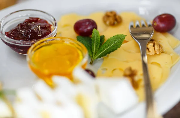 Plate of Cheese on white plate — Stock Photo, Image