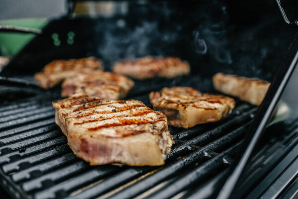 Grilled beef steaks on the grill