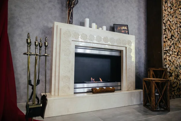 Fireplace in bright living room — Stock Photo, Image