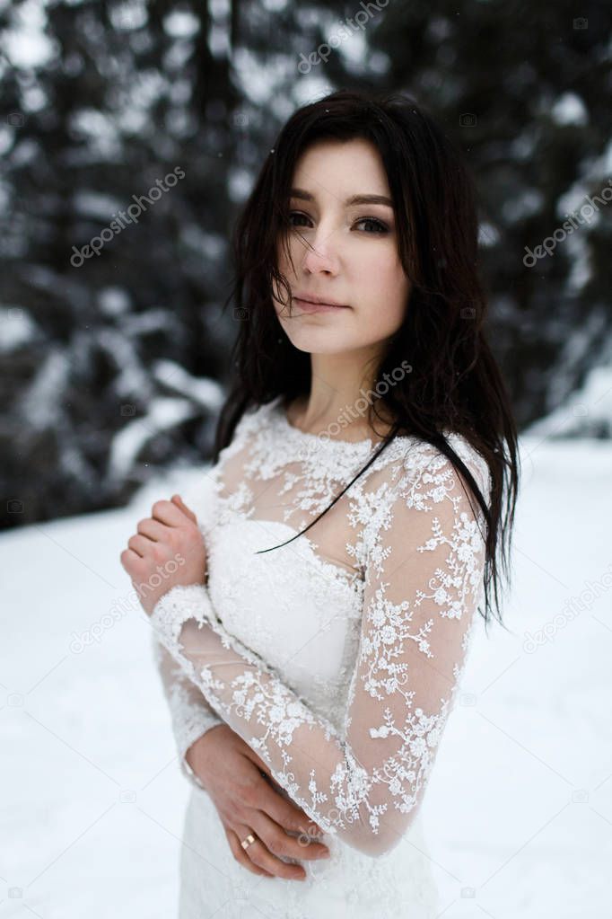beautiful bride in winter forest