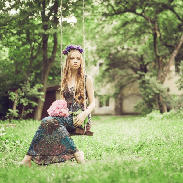 young woman  in the flowered garden