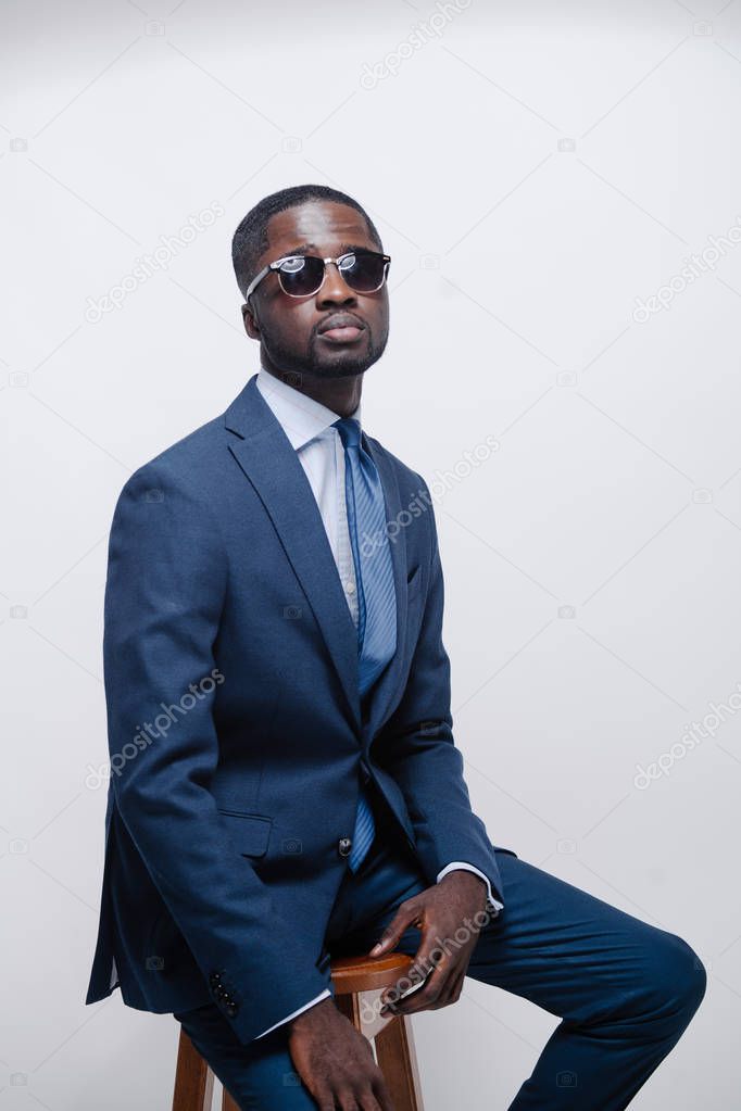 Confident young African man in a stylish suit
