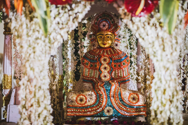 monastery altar with deities of Padmasambhava,Golden Buddha in India