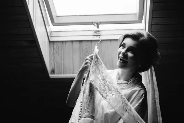 Attractive Young Bride Smiling Holding Wedding Dress — Stock Photo, Image