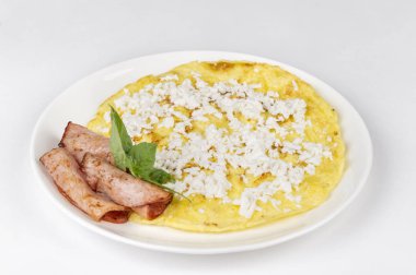 close-up shot of delicious omelet with cheese and bacon