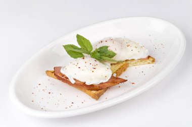close-up shot of delicious bread slices with poached eggs