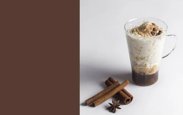 cold fresh ice coffee with cinnamon in white background