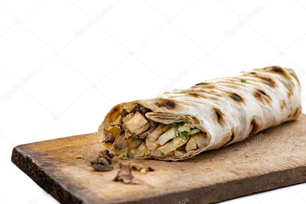 Doner Kebab Gyros Shawarma beef or chiken roll in pitta bread  sandwich on wooden desk