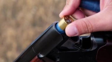 The hunter charges the rifle.Male hunter ready to hunt with hunting rifle.slow motion