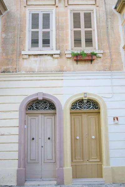 doors of apartments in old house, facade front view