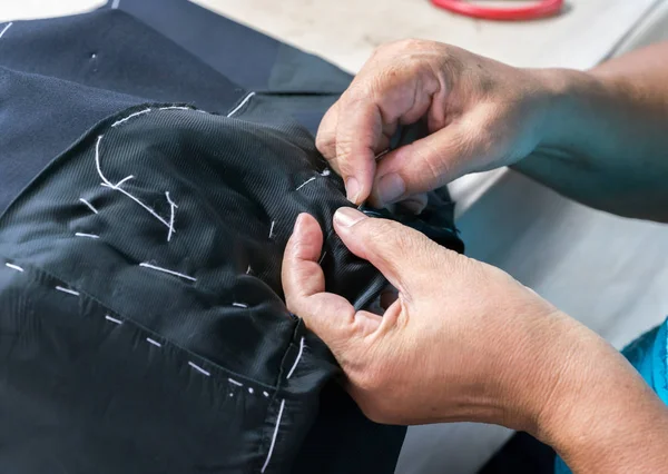 Sewing suits , tailoring by hand — Stock Photo, Image