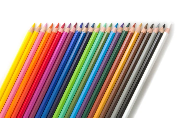 Lápices de colores inclinados sobre blanco — Foto de Stock