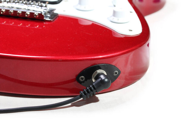 Electric guitar connected by cable