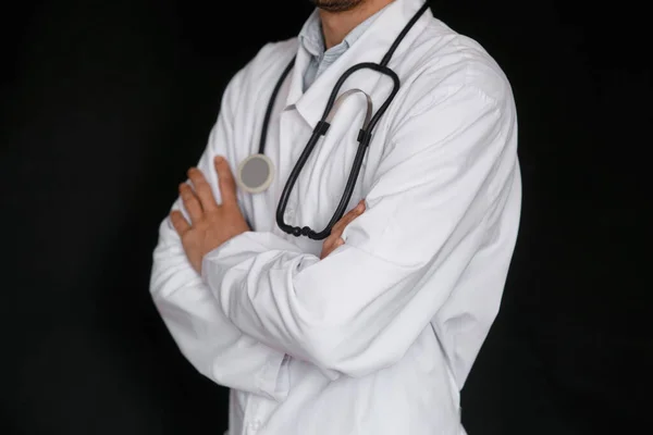 Male Doctor Black Background Stethoscope His Hands Close — Stock Photo, Image