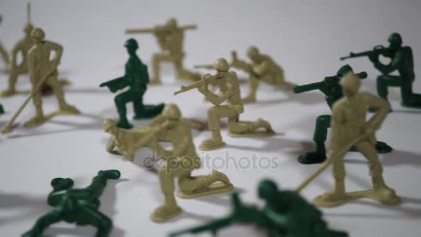 Five year old boy playing with toy soldiers — Stock Video