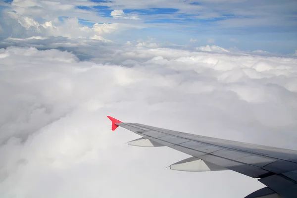 Clouds and sky as seen through window of an aircraft — Stock Photo, Image