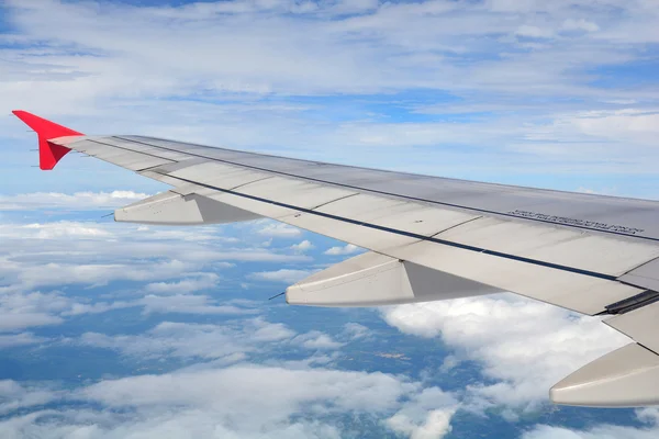 Clouds and sky as seen through window of an aircraft — Stock Photo, Image