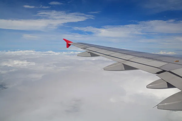 Clouds and sky as seen through window of an aircraft — Stock Photo, Image