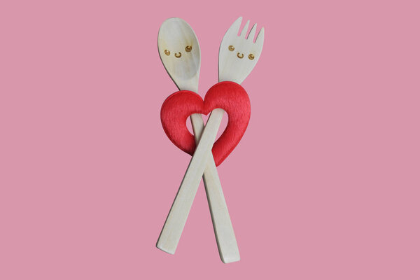 Handmade smile wooden spoon and folk with red heart shape on pin