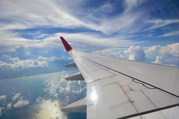 View of beautiful cloud and wing of airplane from window — Stock Photo, Image