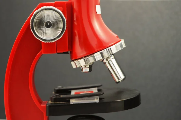 Closeup Red Microscope Black Gradient Background — Stock Photo, Image