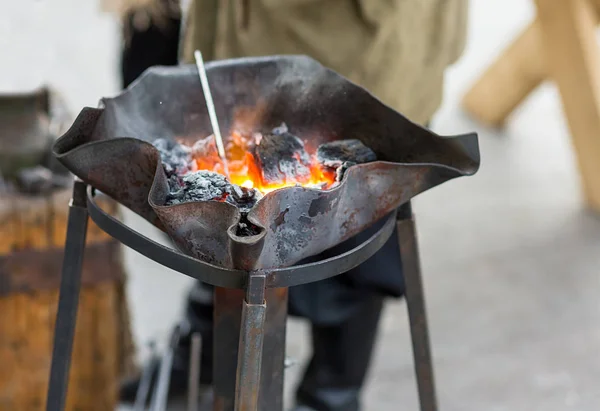 fire blacksmith forge handmade burnt metal with winding wavy edges