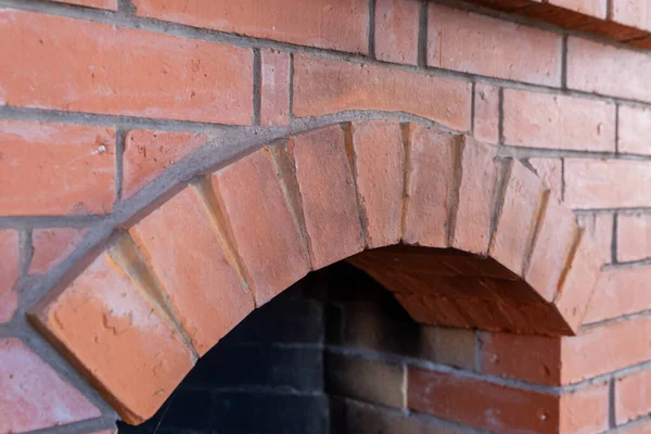 fireplace arch laid out of bricks semi-circle close-up background design