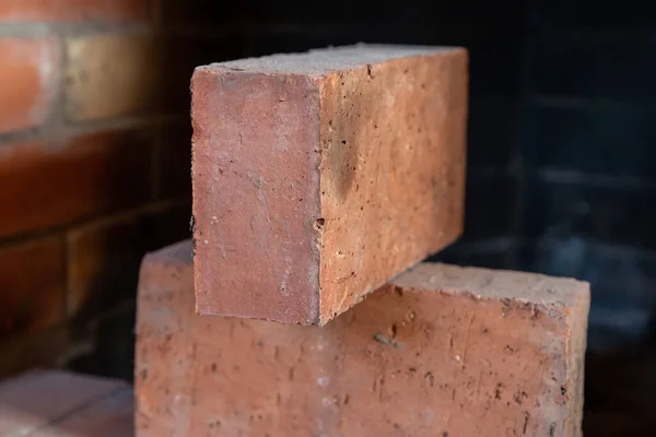 pair of red bricks close up, building material for building a house and a fireplace