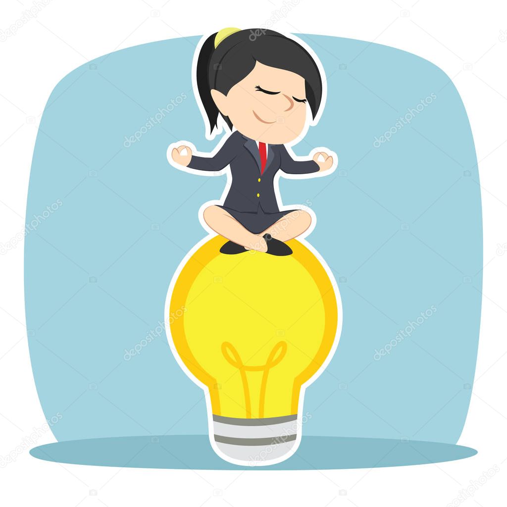 businesswoman doing yoga on bulb