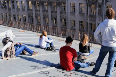 Teens on the roof of the city clipart