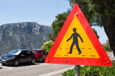 The pedestrian crossing sign in the mountains clipart