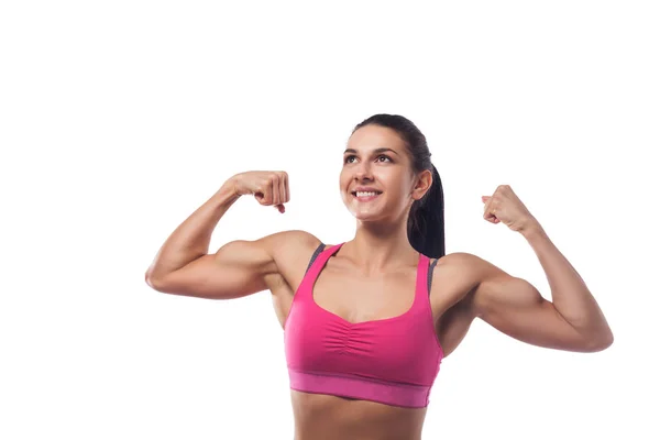 La mujer muestra músculos —  Fotos de Stock