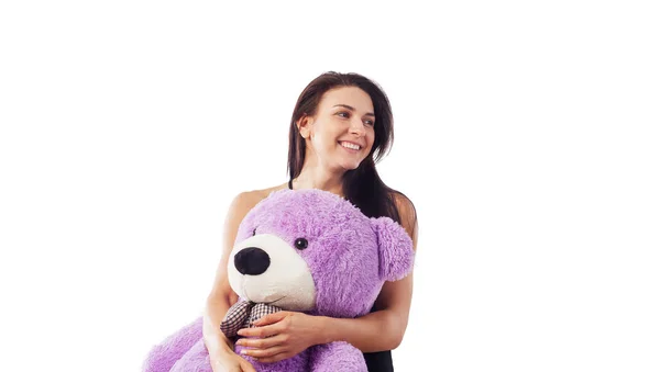 Mujer abrazando oso de peluche —  Fotos de Stock