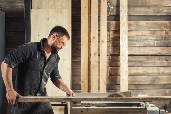 carpenter sawing board