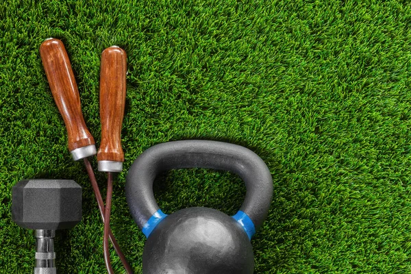 Jump rope, weight on the grass — Stock Photo, Image