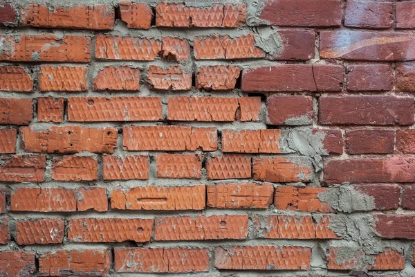 Broken old brick wall. Brick background for creativity