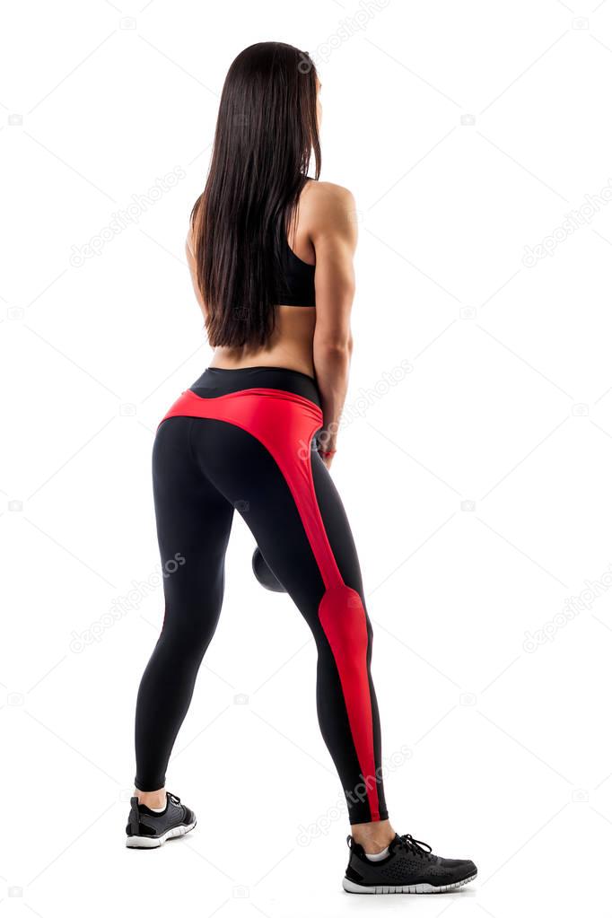 woman in sports clothes makes  squat