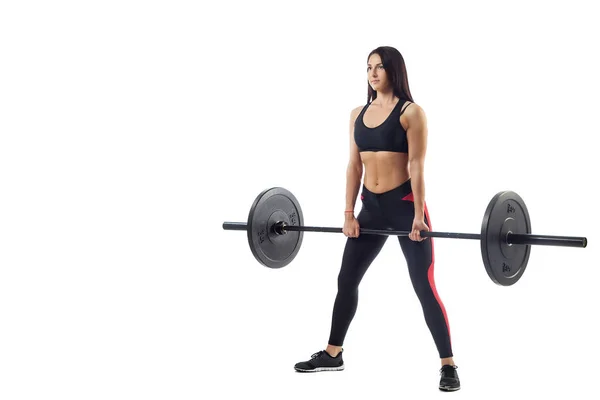 Mujer haciendo sentadilla con barra — Foto de Stock