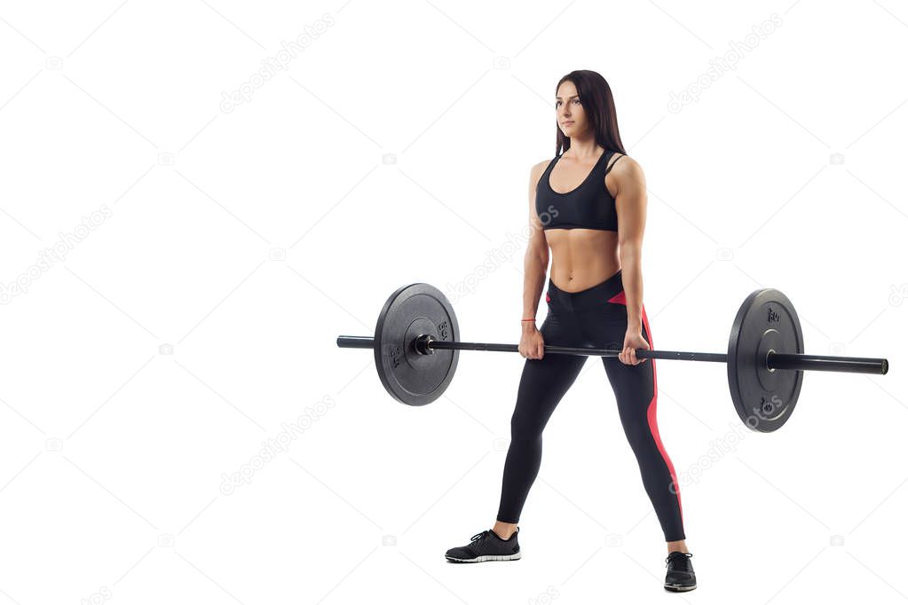 woman doing squat with barbell 