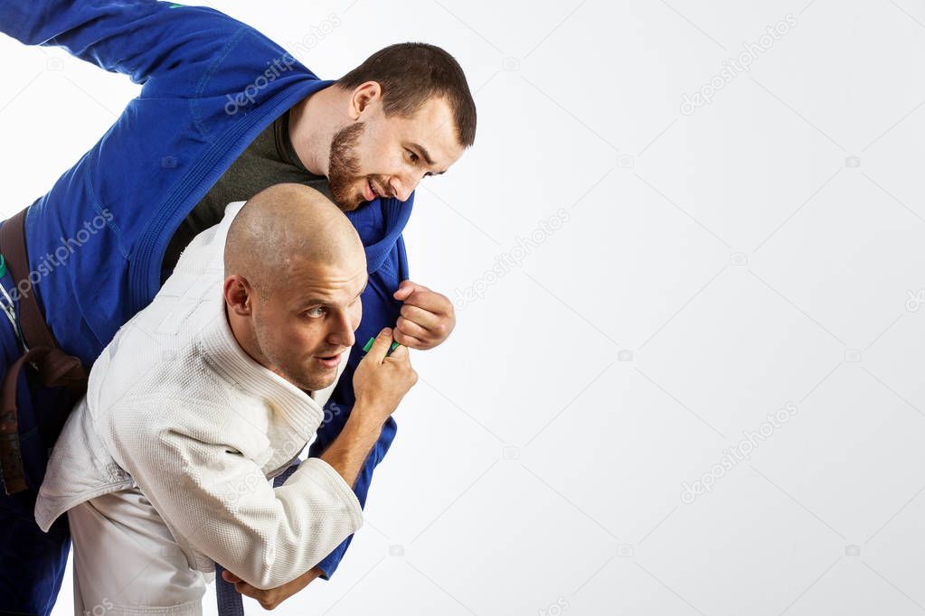 two men  fight judo