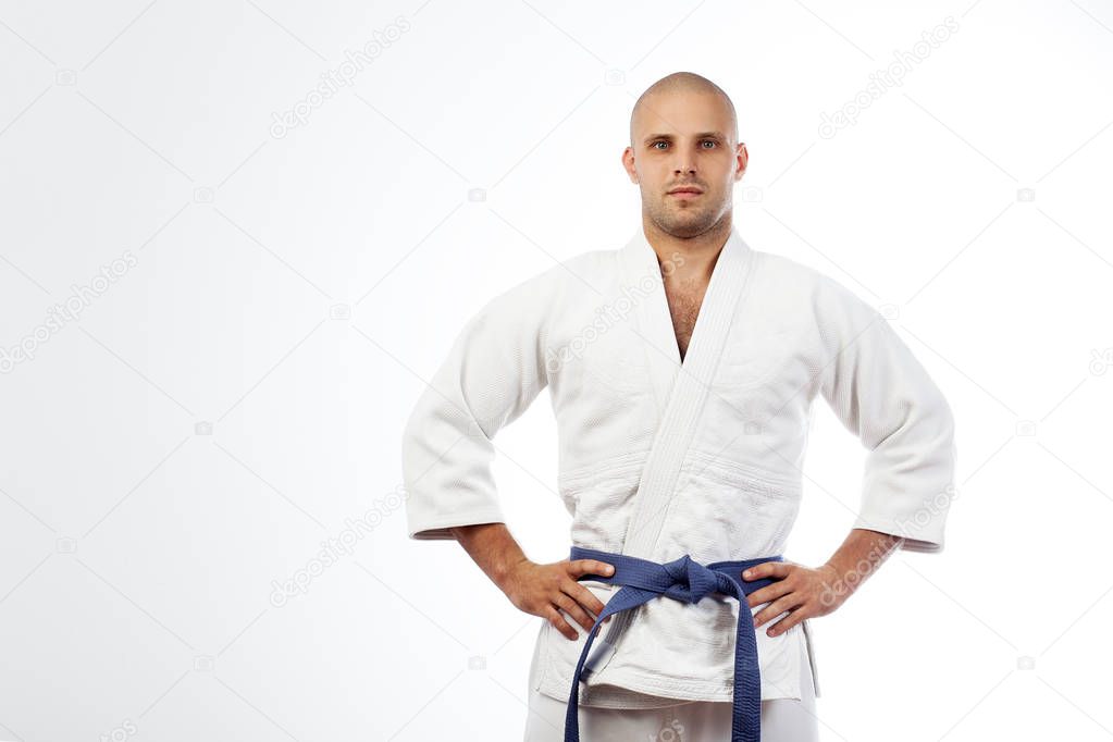 man in a white kimono  posing