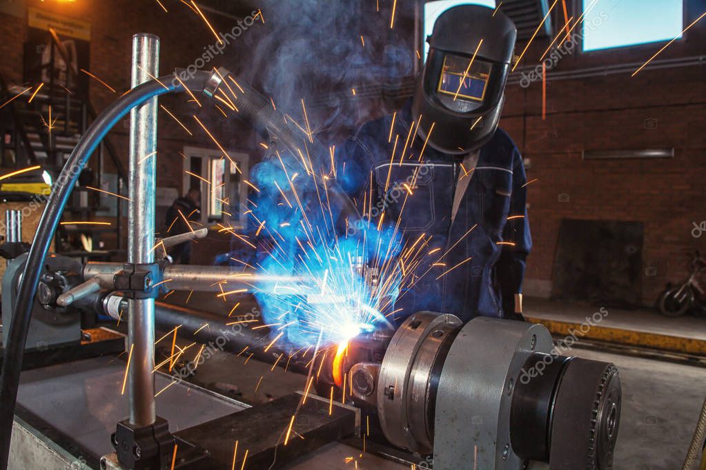 Mechanic welding metal — Stock Photo © everyonensk 171877562